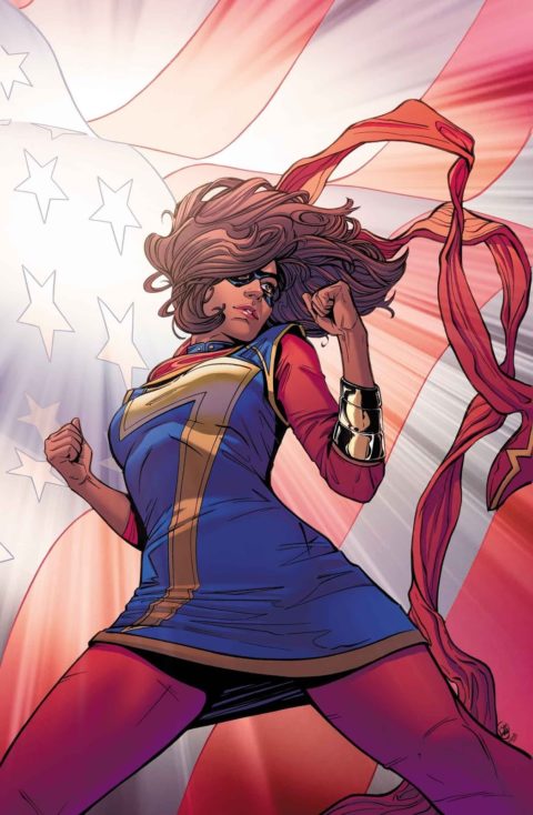 Ms. Marvel stands heroically in front of the American flag